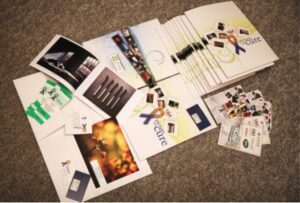 Image of components of a media kit, including flyers, tickets, etc.